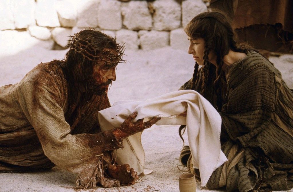 Jesus falls woman helps
