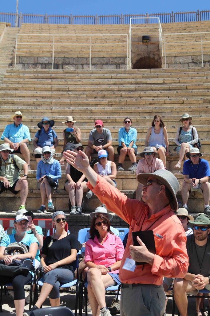 Pastor Tim McCoy explains a point while teaching in a theater at Caesarea. Many events in the book of Acts happened in this location.